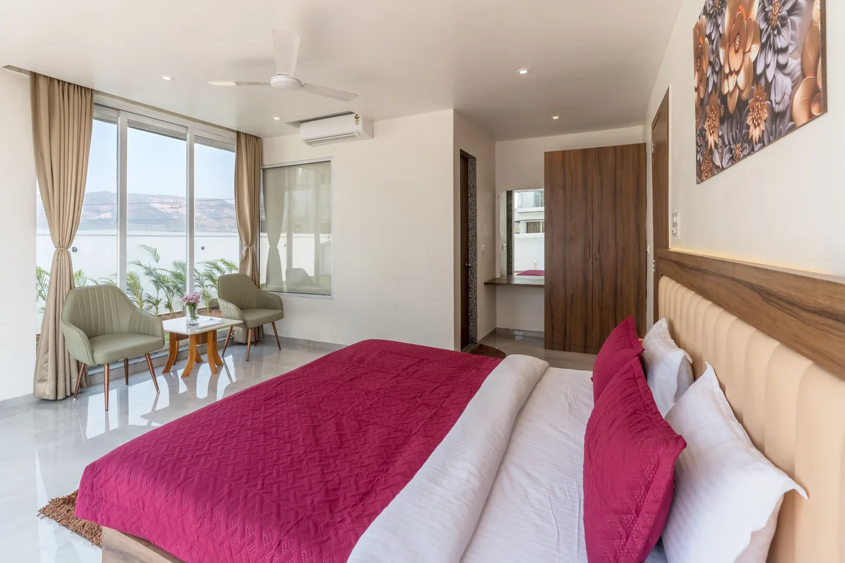 Bedroom made up with white linen