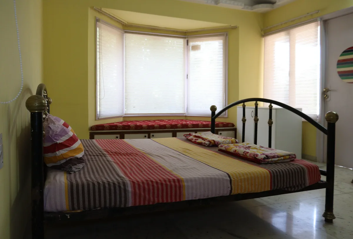 Bedroom made up with white linen
