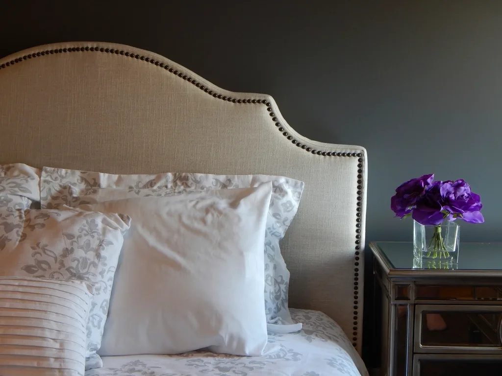 Bedroom made up with white linen