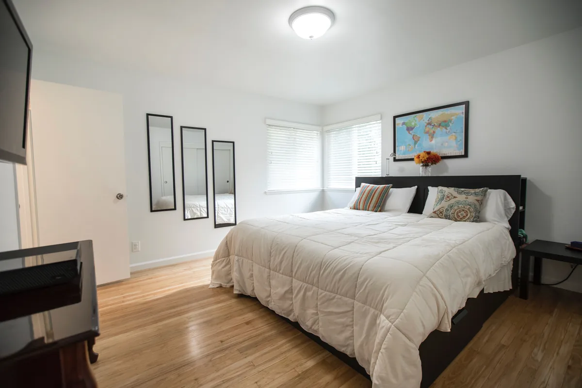 Bedroom made up with white linen