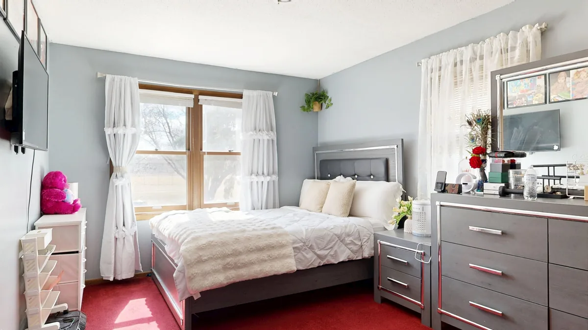 Bedroom made up with white linen