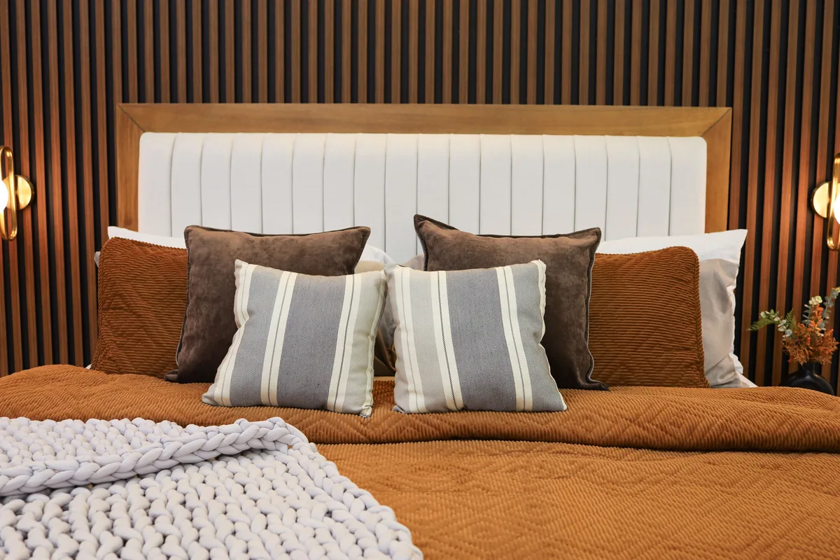 Bedroom made up with white linen