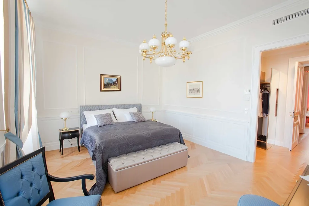 Bedroom made up with white linen