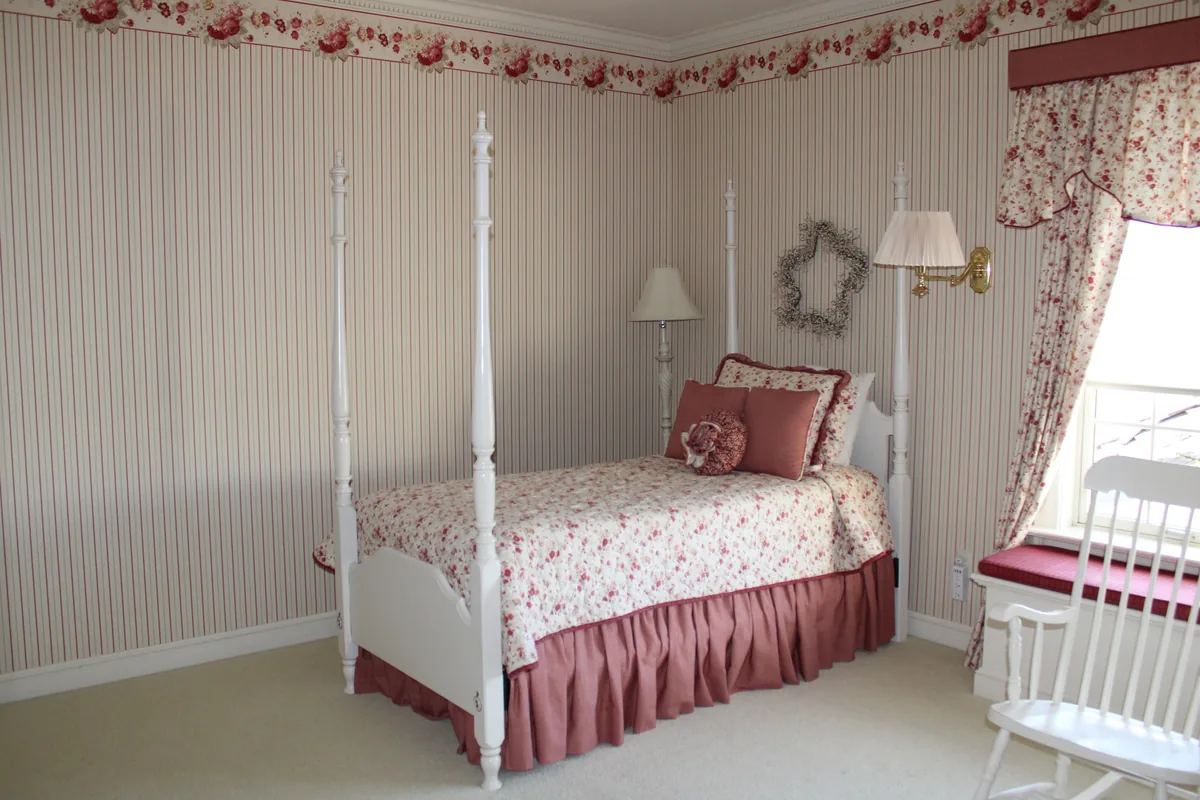 Bedroom made up with white linen