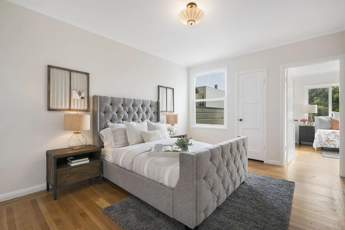 Bedroom made up with white linen