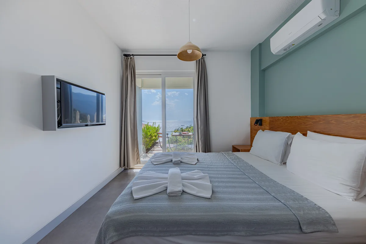 Bedroom made up with white linen