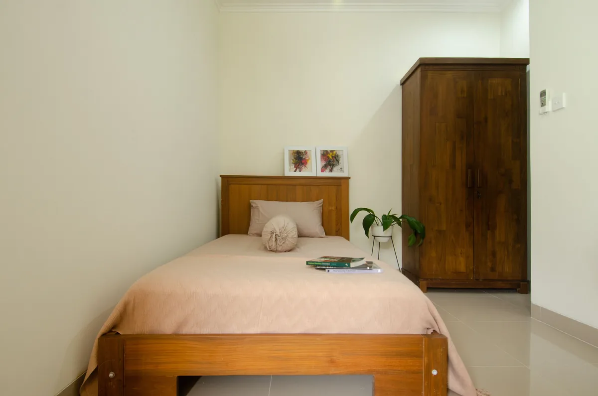 Bedroom made up with white linen