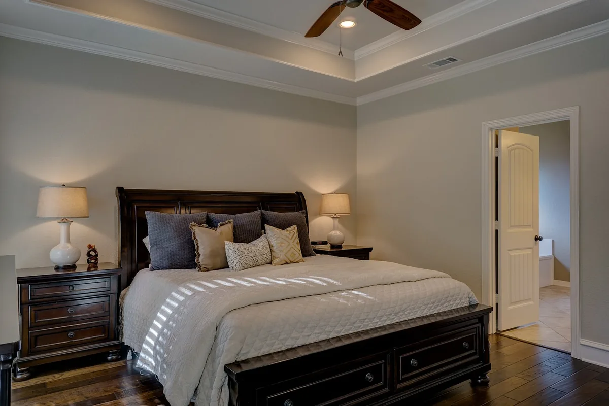 Bedroom made up with white linen
