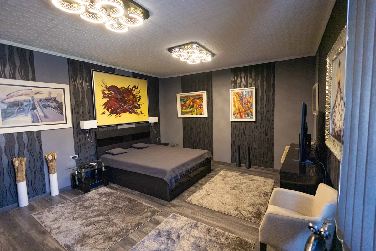 Bedroom made up with white linen