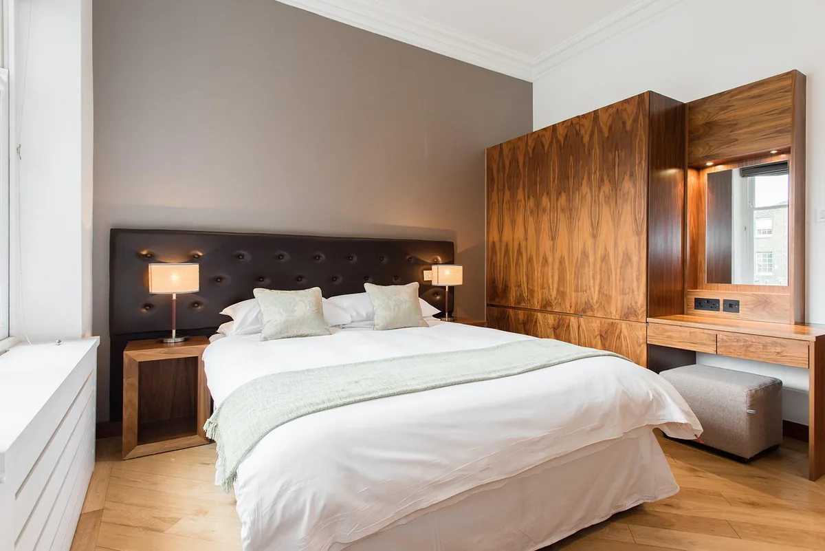Bedroom made up with white linen