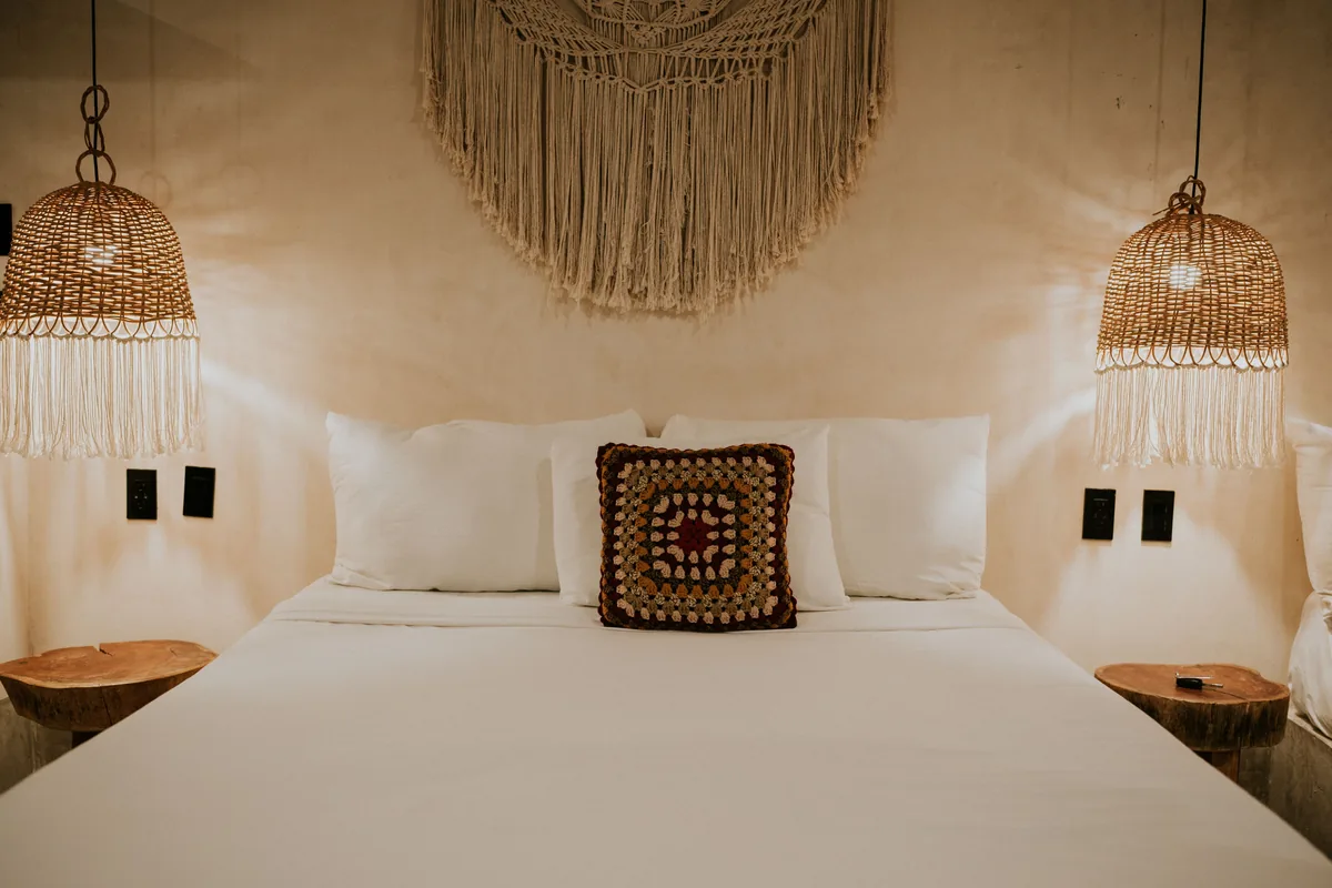 Bedroom made up with white linen