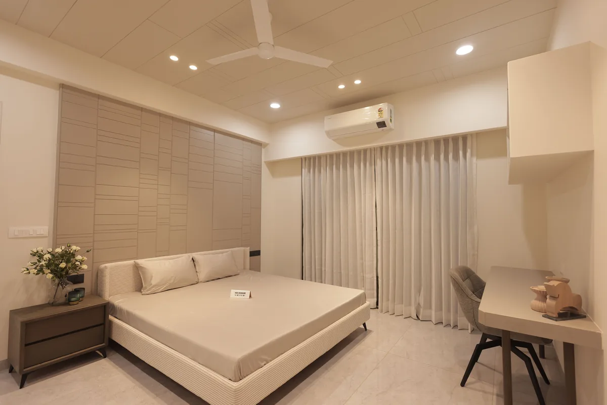 Bedroom made up with white linen