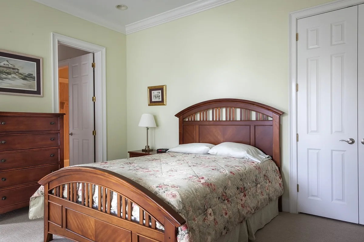 Bedroom made up with white linen