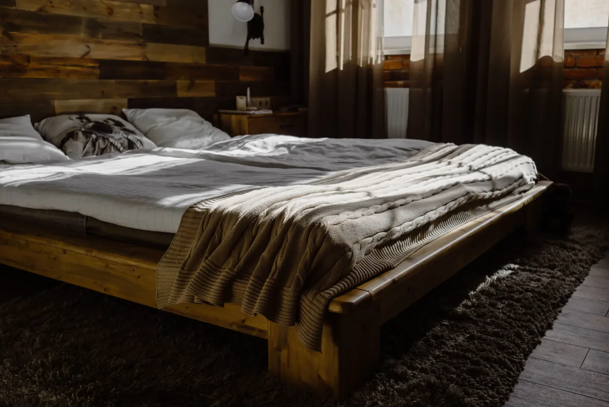 Bedroom made up with white linen