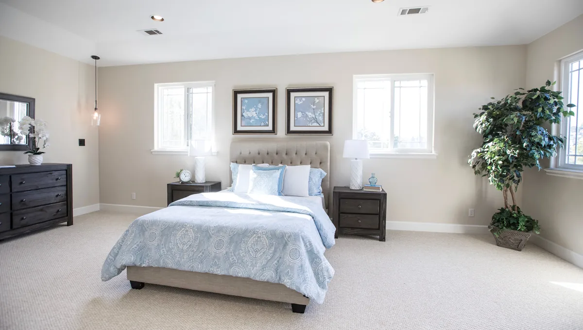 Bedroom made up with white linen