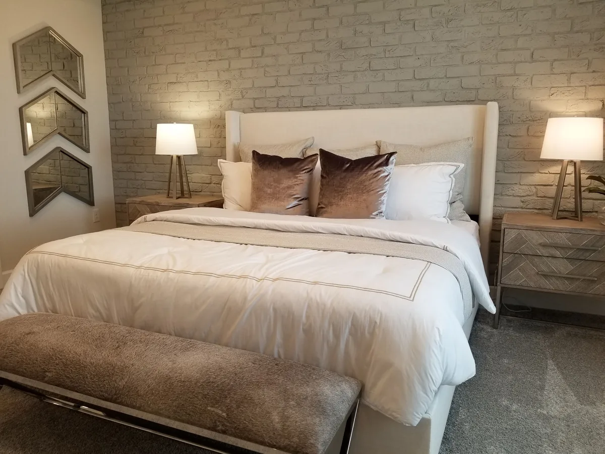 Bedroom made up with white linen