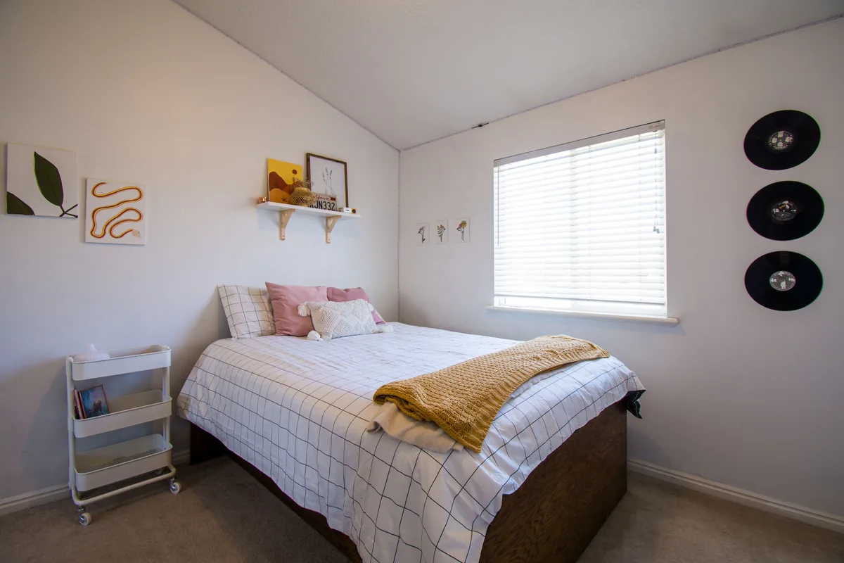 Bedroom made up with white linen