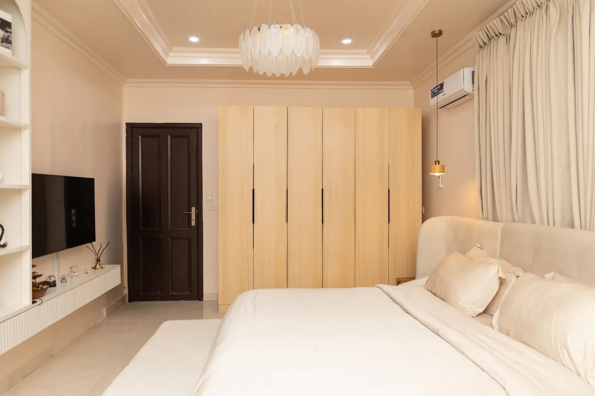 Bedroom made up with white linen