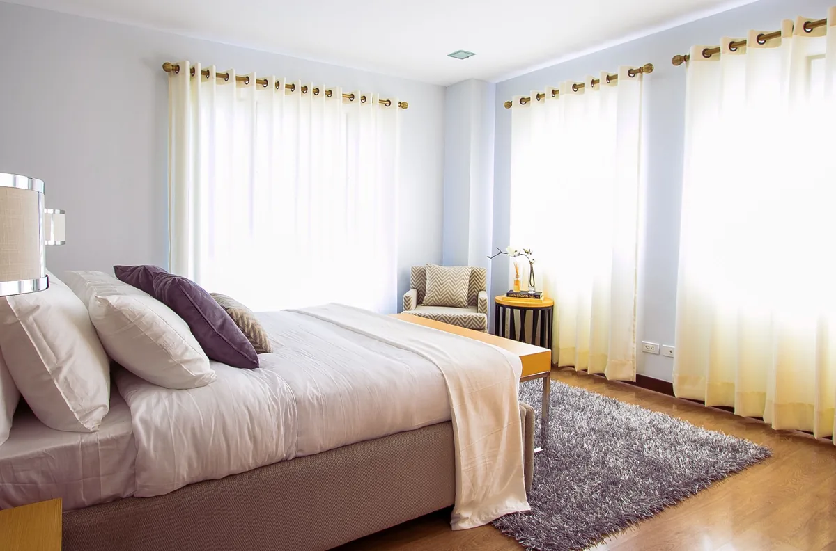Bedroom made up with white linen