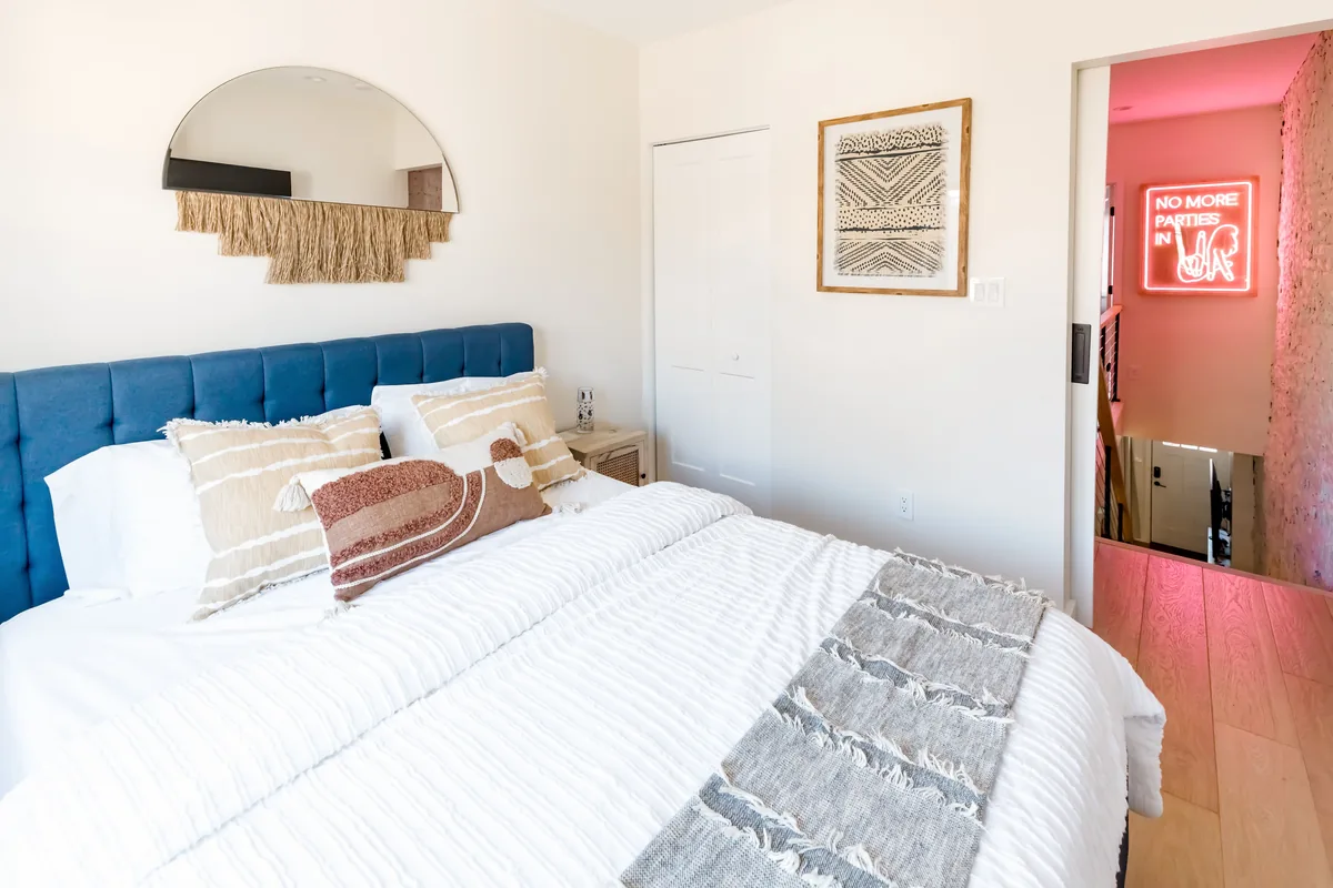 Bedroom made up with white linen
