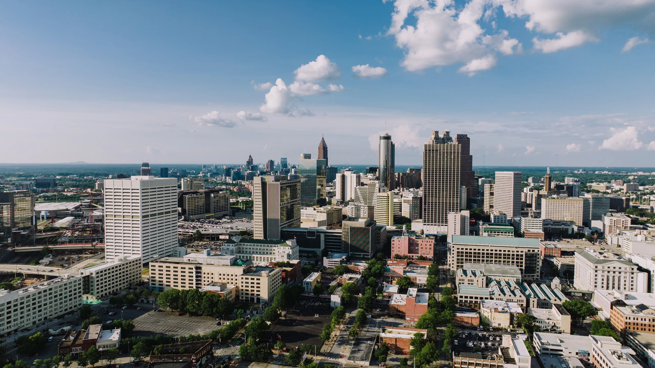 Aerial view of Atlanta skyline under a blue sky