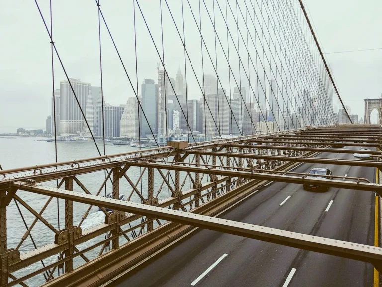 Brooklyn Bridge leading to New York City's skyline