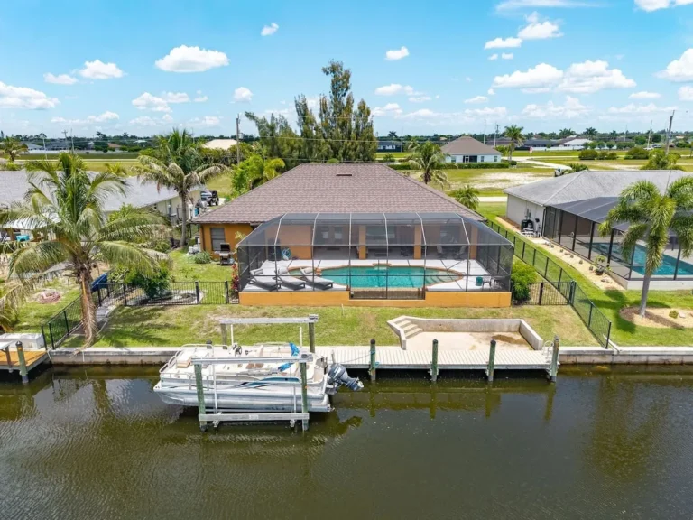 Cape Coral canal home with a private dock and pool