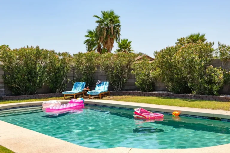 Chandler vacation home pool with loungers and colorful floats