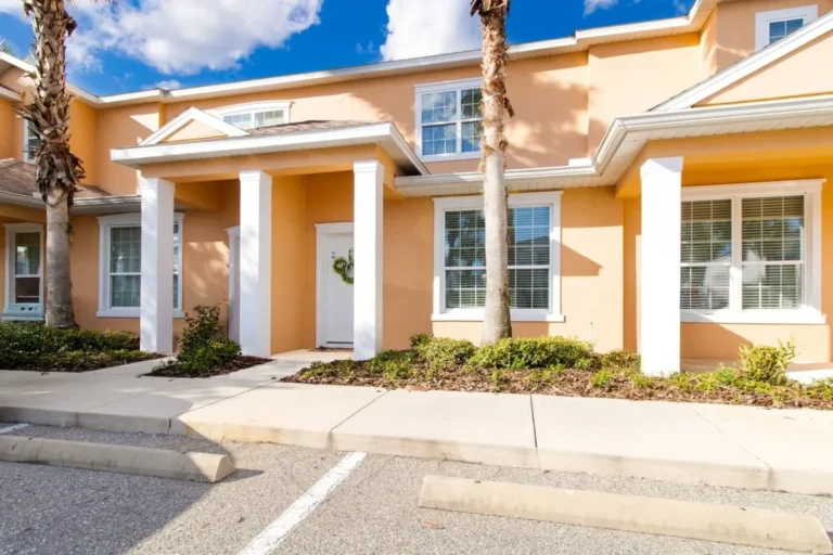 Yellow townhouse exterior at Mickeys Hideaway in Clermont, Florida