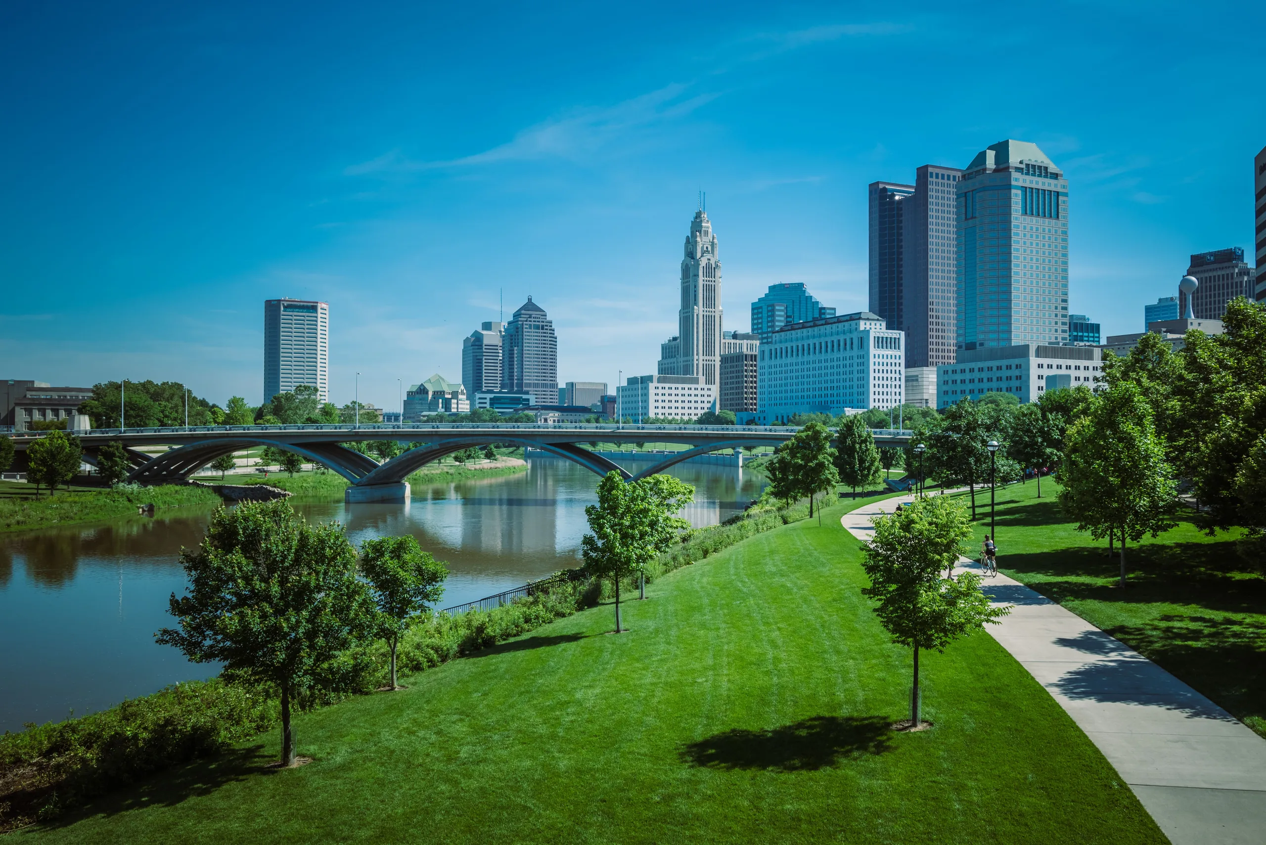 Downtown Columbus skyline above the Scioto River and a riverside park
