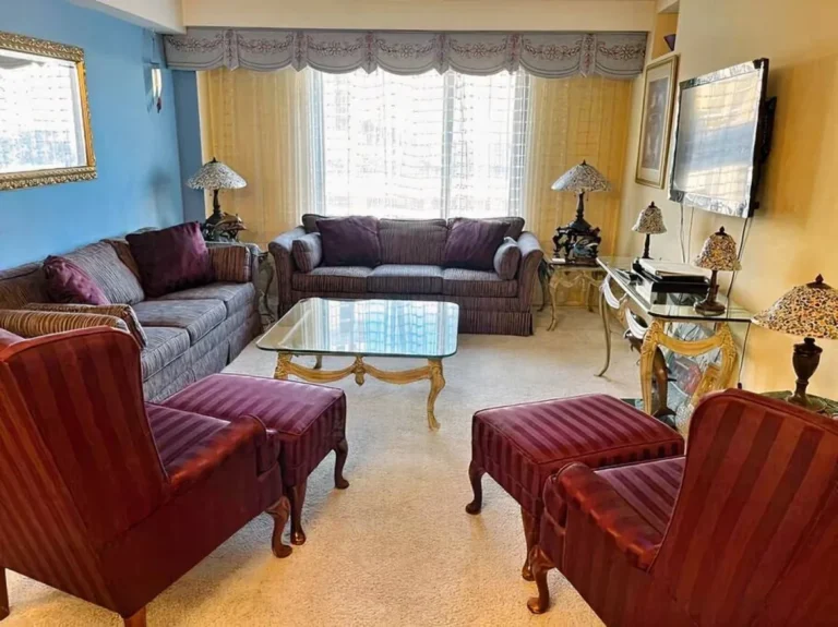 Bright living room in a Jockey Club condo with seating and a dining area