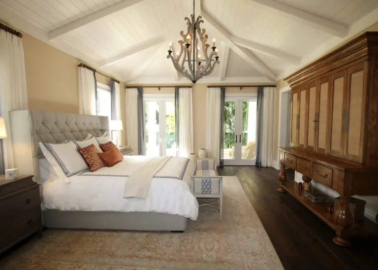 Bedroom with a vaulted ceiling and French doors