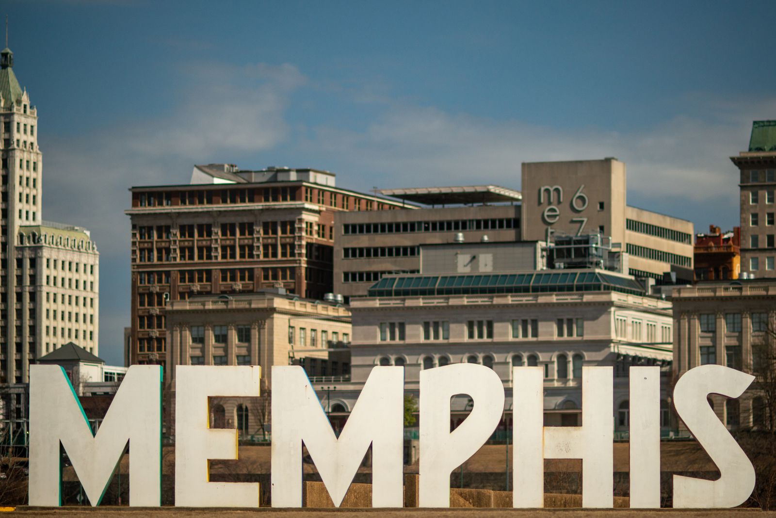 Large MEMPHIS letters in front of historic downtown buildings