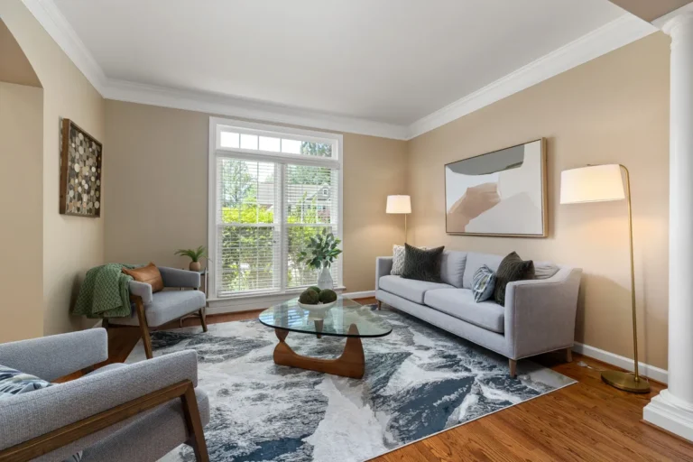 Bright living room with a grey sofa and garden doors