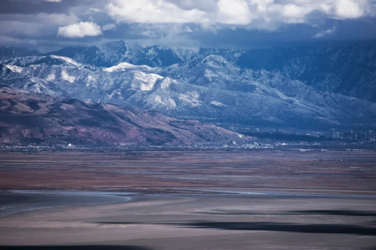 Salt Lake City valley below snow-covered mountains