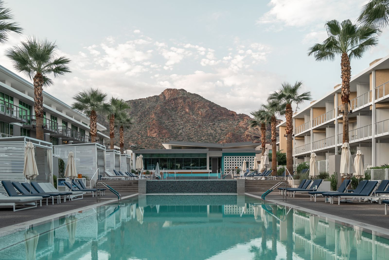 Resort pool with palm trees and a desert mountain in Scottsdale, Arizona