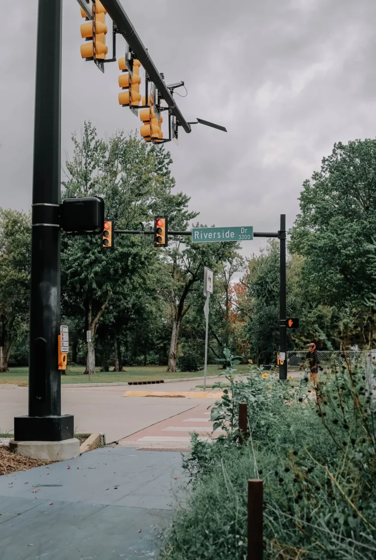 Riverside Drive in Tulsa with trees and a traffic light